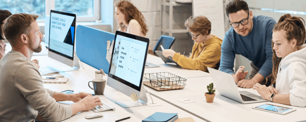Group of people mixed genders working at a table together
