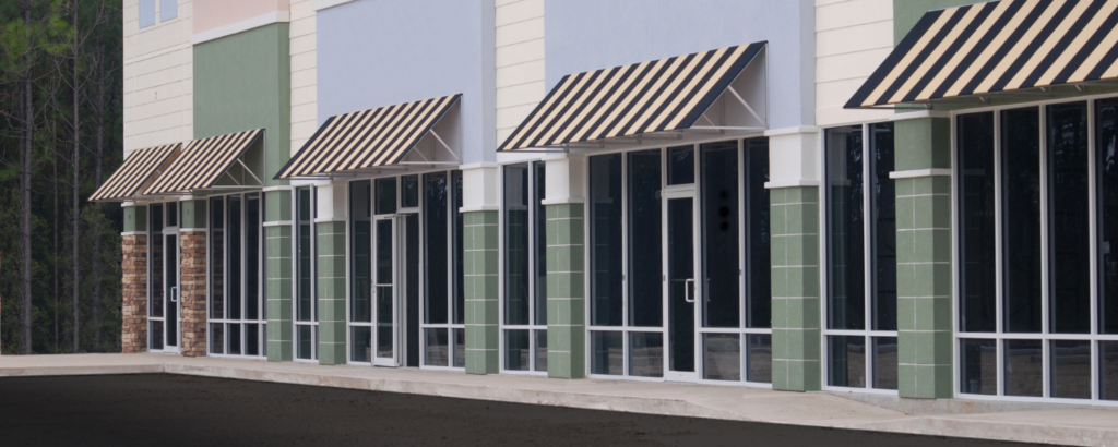 photo of front of retail office space with awnings