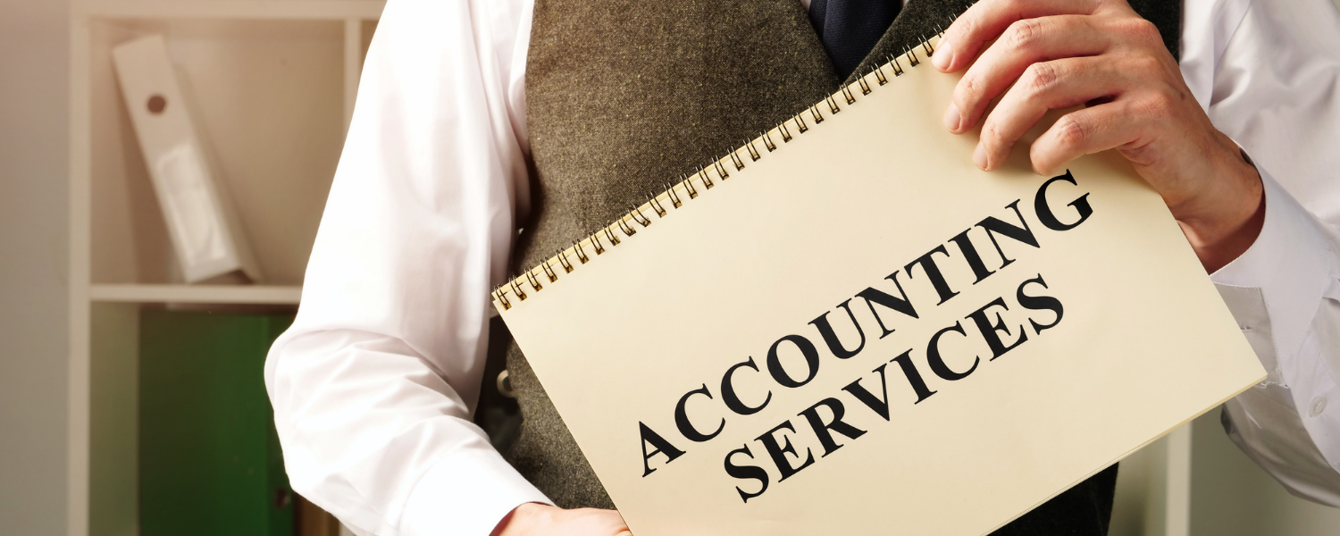 guy holding a sign that says accounting services